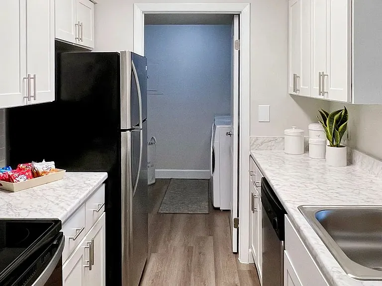 All kitchens come with beautiful stainless appliances and ample cabinetry.