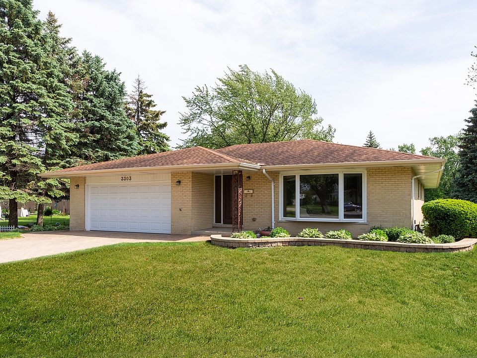 Brick ranch set back from the road.