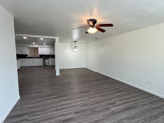 Entry to living room; dining on the right and kitchen to the left of picture