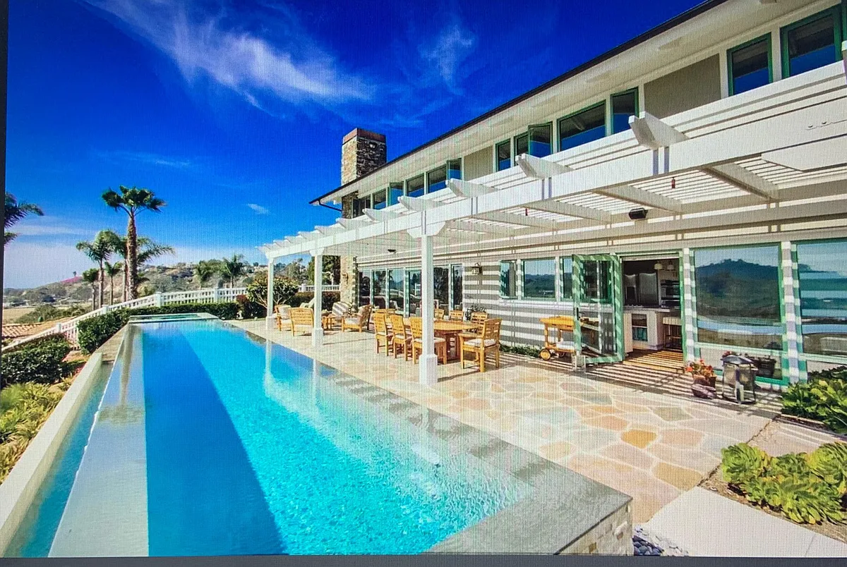 Stunning lap pool/yard with endless views overlooking polo fields and all the way to the ocean - 14707 Polo Point