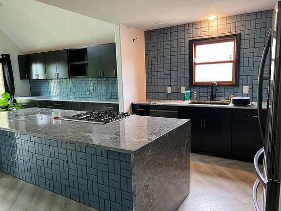 Kitchen with granite and waterfall 10foot island