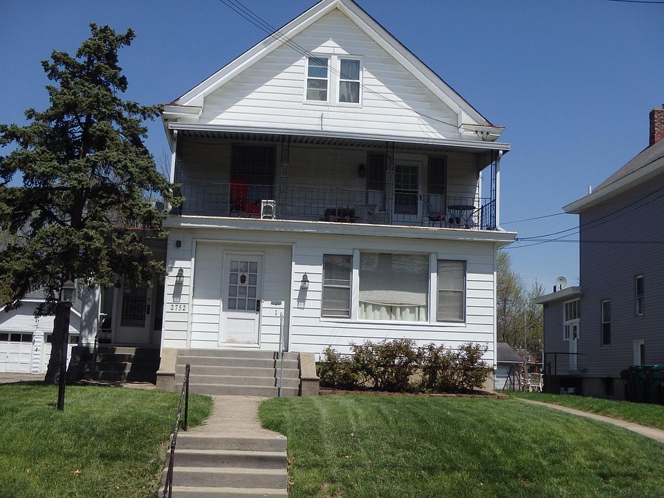 front of house, apartment 2 entrance on the left side as you look at photo