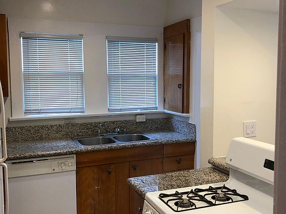 Kitchen with frig, dishwasher and stove