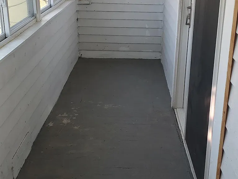 Sun porch adjoining kitchen.