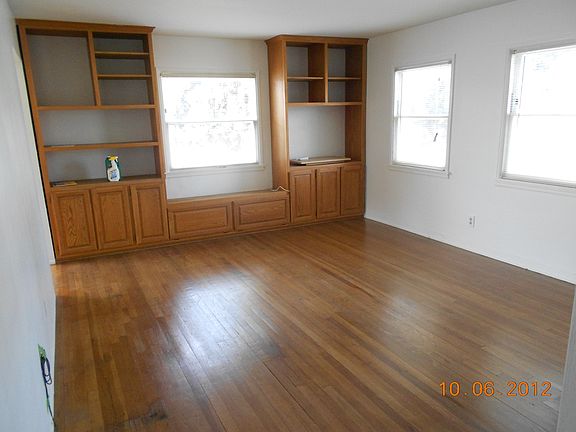 Living Room w/ built in cabinets