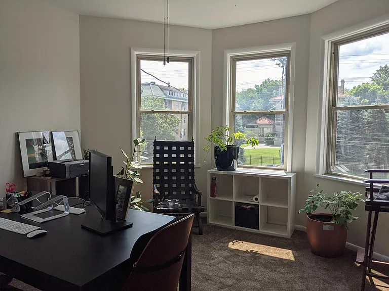 Bedroom #2 on second floor with bay window. Currently being used as an office.