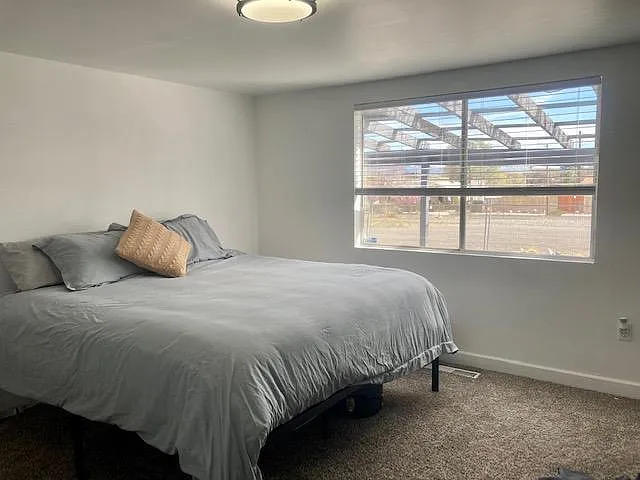 Large master bedroom with king bed and great views of the mountains.