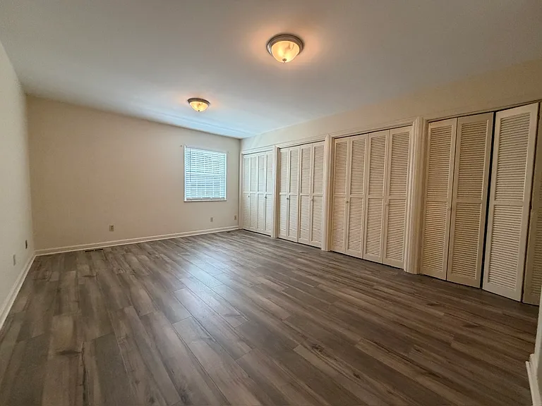 Primary BR has a long wall of closet storage and its own full bath.