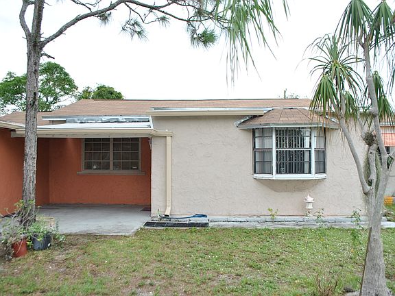 Front Entrance with carport and driveway
