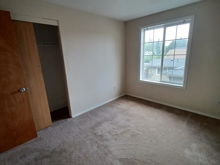 Upstairs bedroom #2 with closet and window