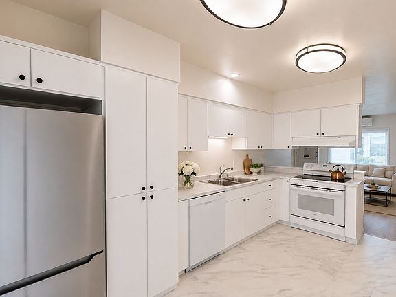 Apartment 1 A Kitchen with Living Area beyond furnished for illustrative purposes