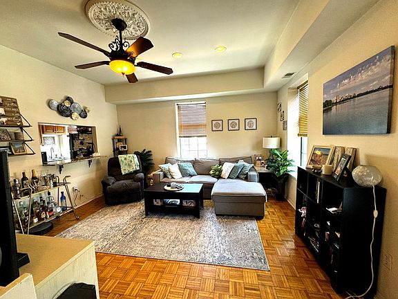 "Elegant Ceiling Detail and Fan"
Decorative ceiling medallion, 10-foot ceilings, and a classic fan complete the room.