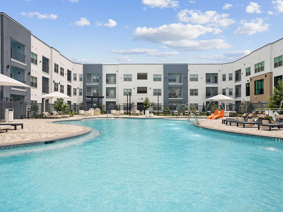 Salt-Water Pool - Resort-style pool with sun shelf, cabanas and grills for relaxing and entertaining close to home.