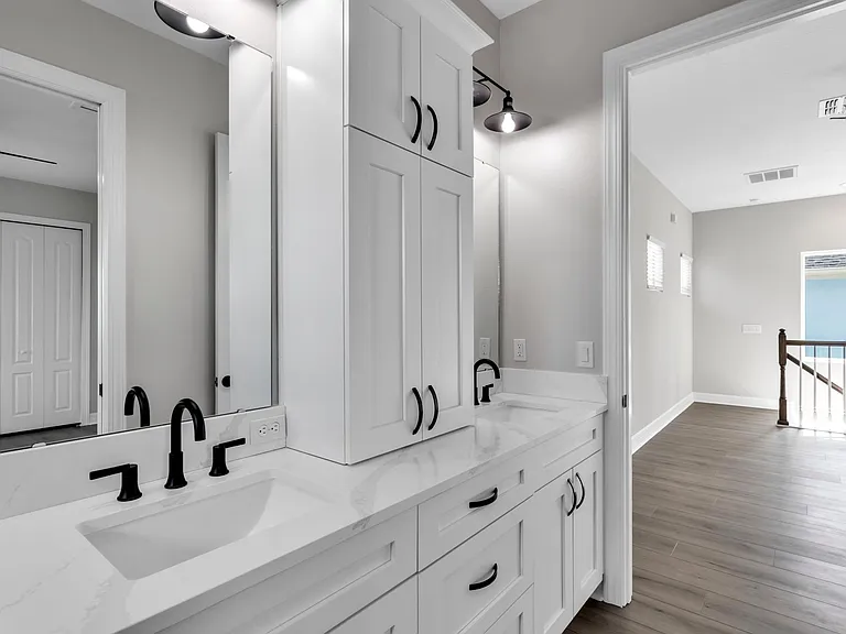 Double sinks and cabinets.