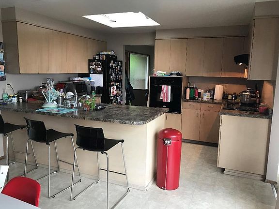 Kitchen. There is a door to the garage and entry to the living room.