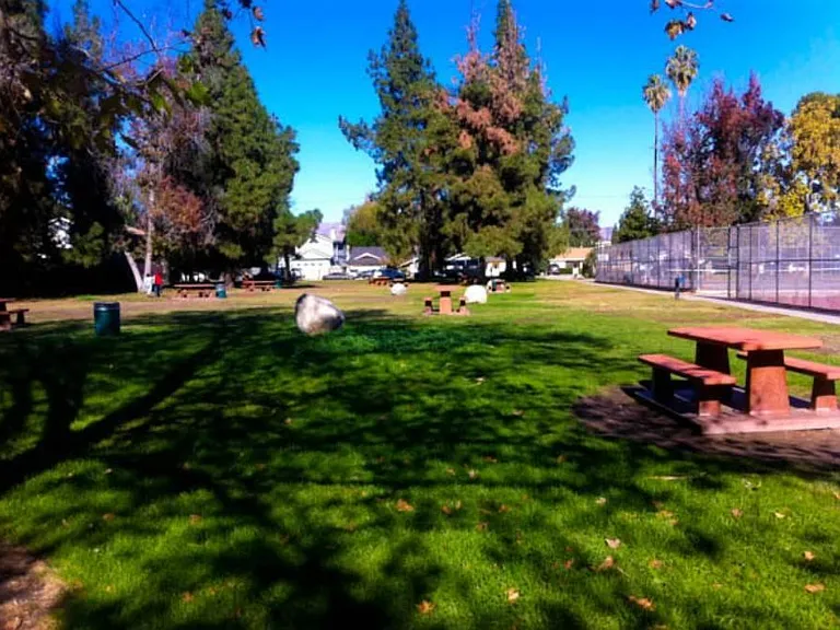 Park benches and greenery 300 yards away.