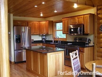 Kitchen
						:
						Granite countertops, cherry cabinets and stainless steel appliances