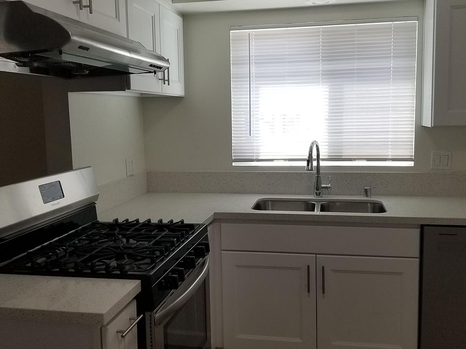 Brand new kitchen with dish washer and stove.