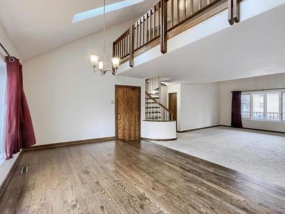Open floor plan with elevated dining room.