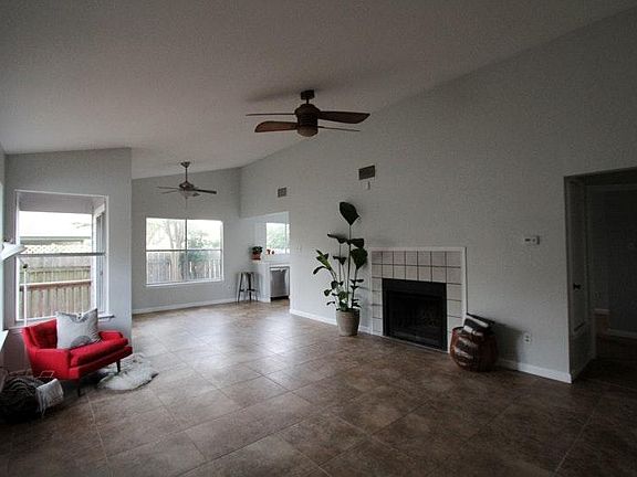 Large open concept main living room with half vaulted ceilin