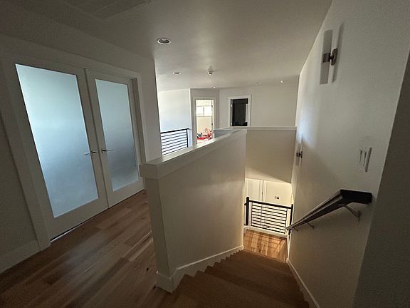 upstairs view of hallway and stairs