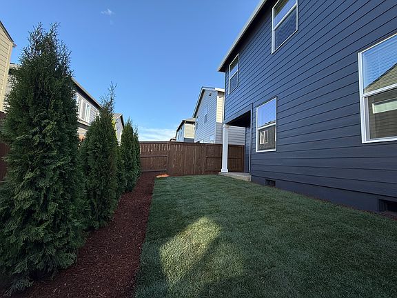 Landscaped back yard with automatic irrigation