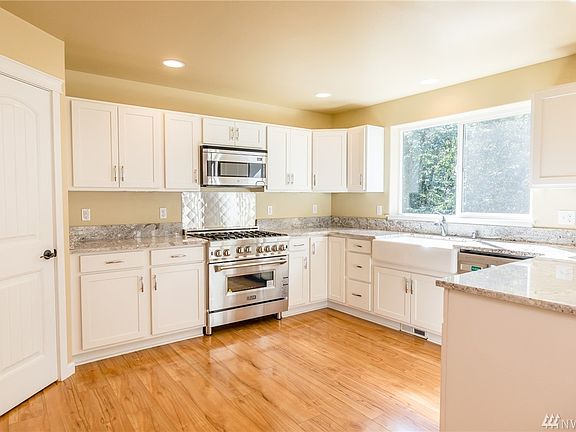 Kitchen with brand new range, and walk in pantry