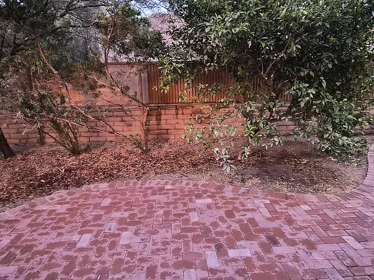 paver patio, hybrid Adobe wall and rusted steel fencing