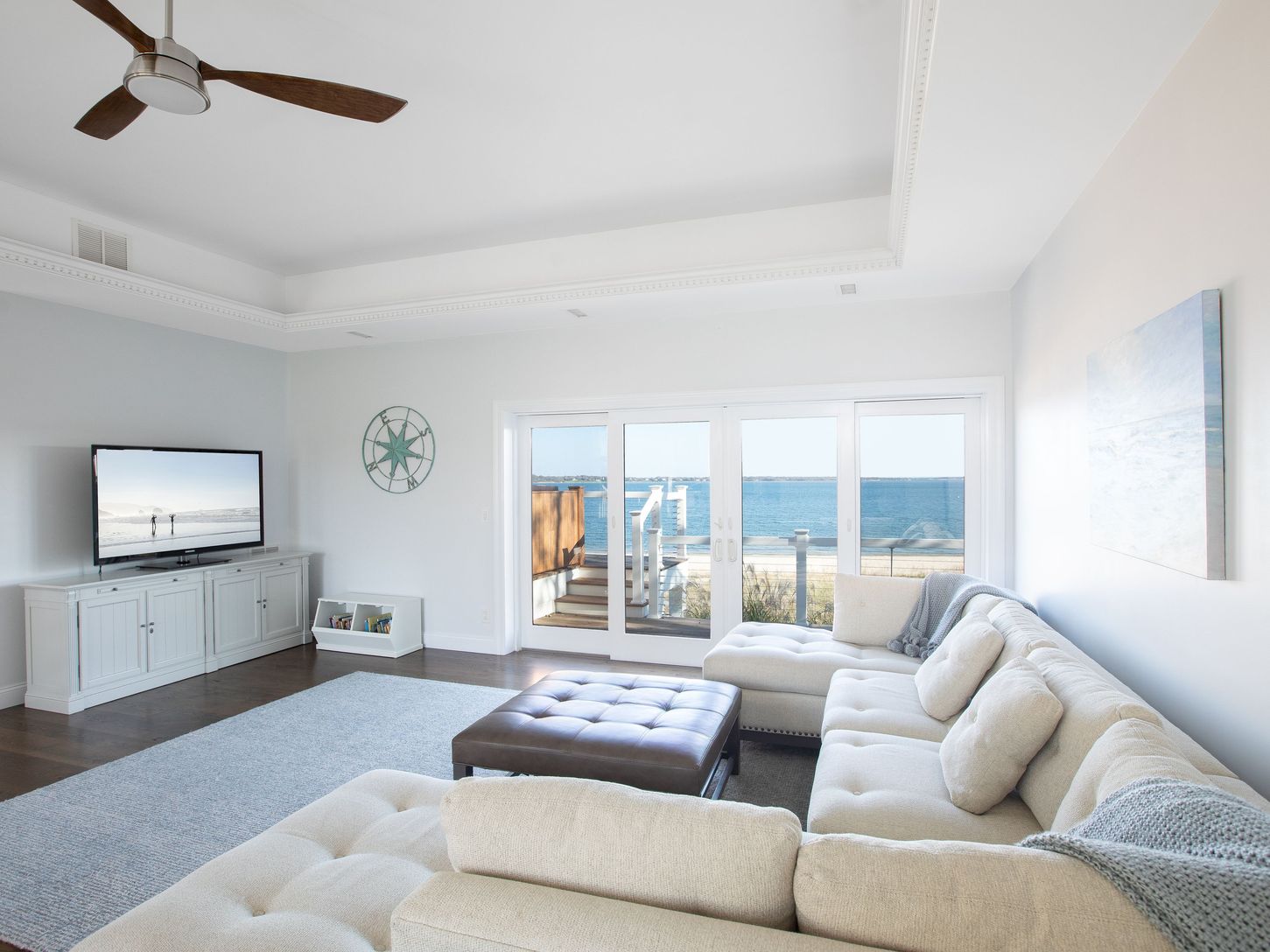 Great room with tray ceiling and indirect lighting sets the mood.