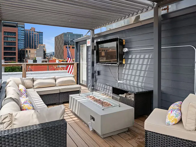Roof Deck seating area. Fire pit and TV.