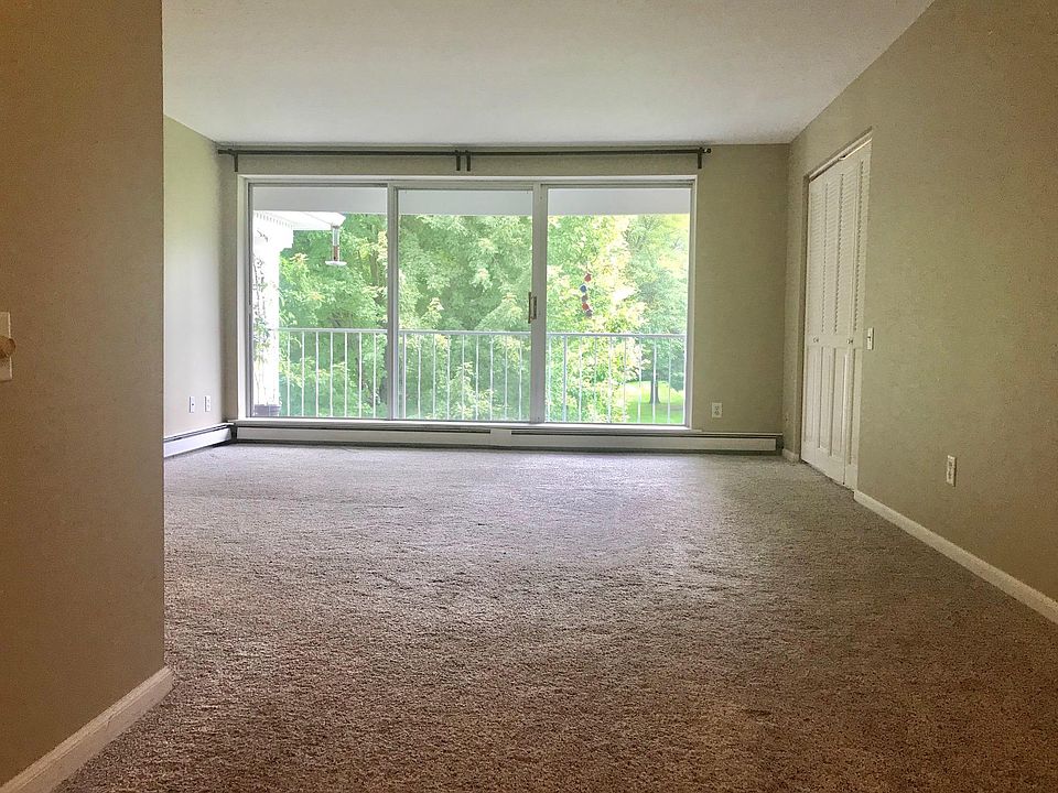 Beautiful living room with floor to ceiling windows and balc