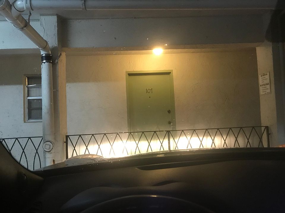 View from parking space facing front door