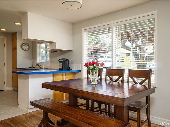 Open design with plenty of room for entertaining and holiday gatherings, wood flooring, dining bar in kitchen.