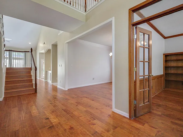 Open foyer, private office, formal dining and stairs.