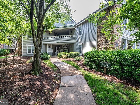 Home is Surrounded by Trees, Bushes, & Flower Beds