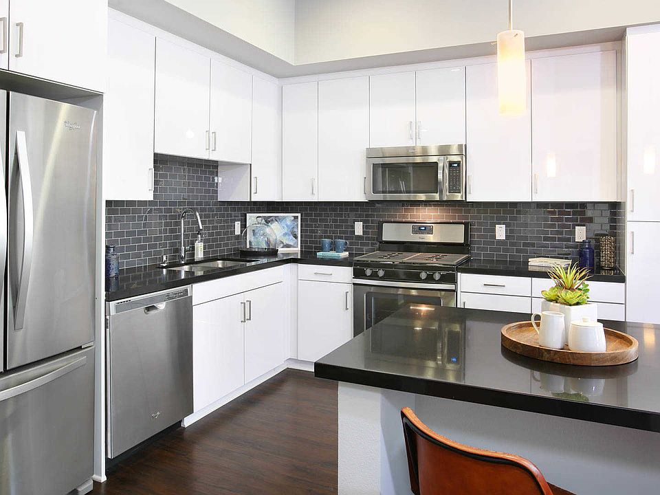 Kitchen with Island, Quartz Counters and Stainless Steel Appliances