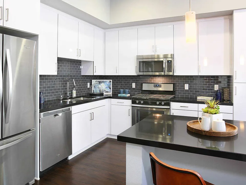 Kitchen with Island, Quartz Counters and Stainless Steel Appliances