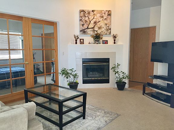 open living room with vaulted ceilings and lots of light