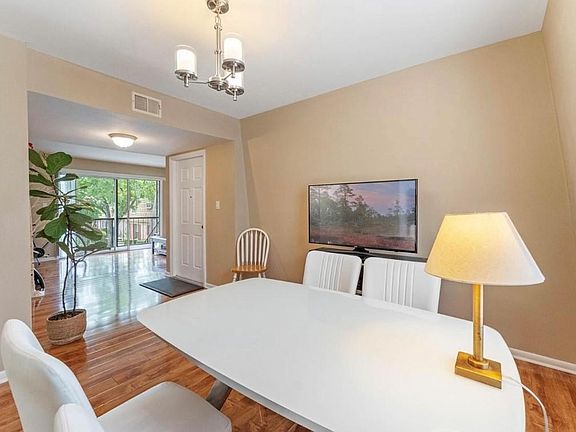 large dining room leads to even larger family room.