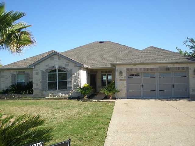 Elegant elevation with this single story lake view home