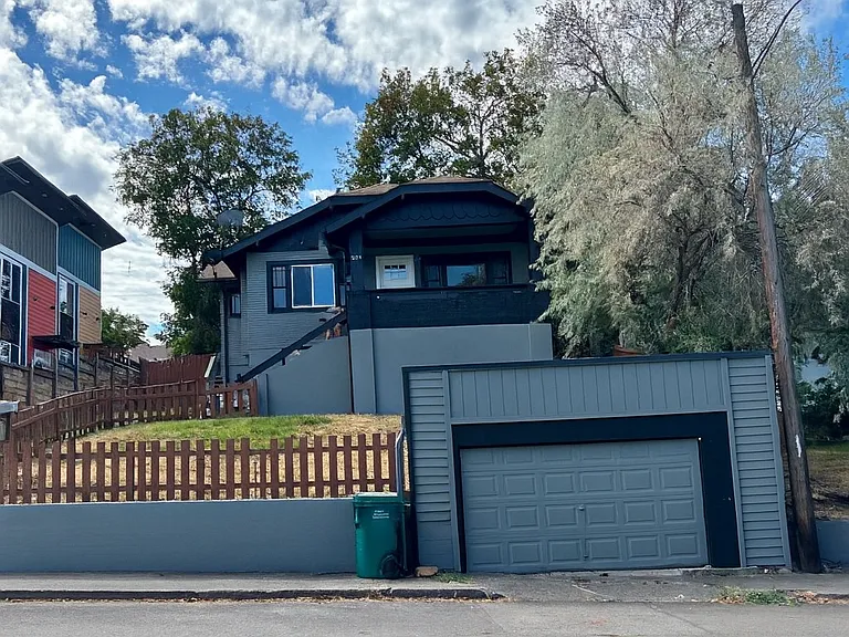 Covered porch with detached garage