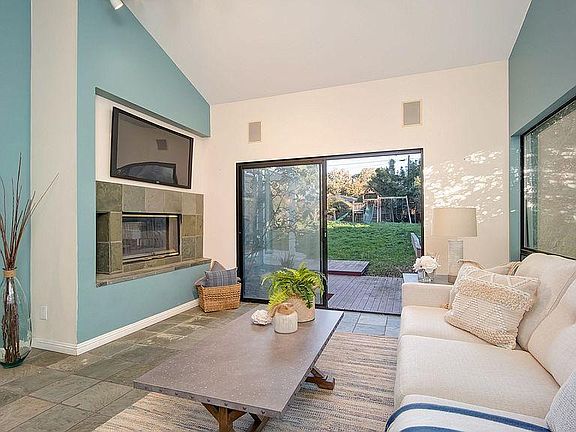 Great room you can relax with a fireplace with sliding door to patios