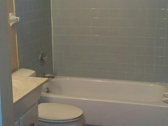 Bathroom off hallway leading into master bedroom