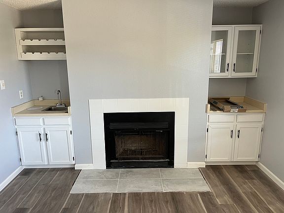 Fresh New Paint in Family Room, Freshly painted fireplace, Brand new flooring and Beautiful new tile installed. NOTE...Fireplace is for decorative purposes only and not usable.