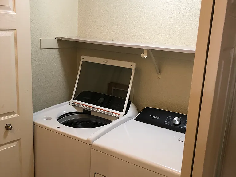 Laundry Closet located down hallway.