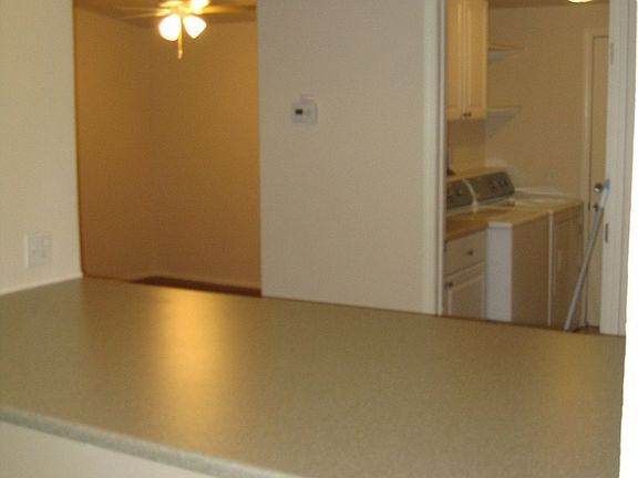 from kitchen over breakfastnook/bar to dining room & laundry