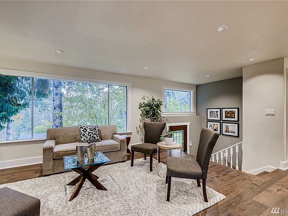 Living Room with new hardwood floors, new hand rail will be installed.