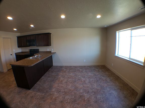 View of dining area and kitchen. Newer LVP flooring (not pictured).