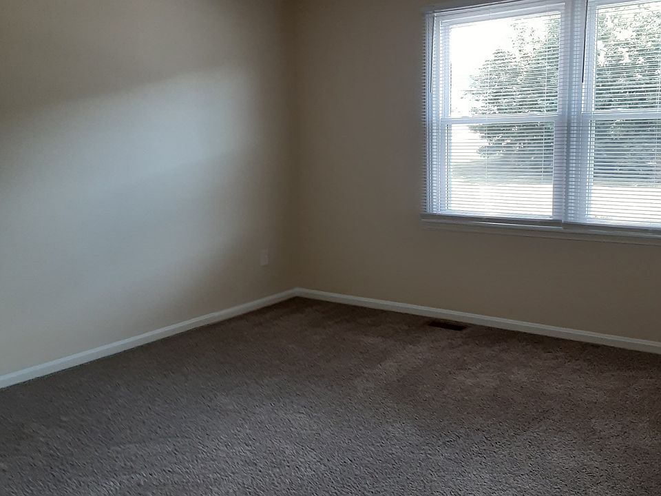 Your looking at bedroom 1 from hallway, is upstairs. All new carpet, paint, ceiling fan with lighting, new windows and mini blinds