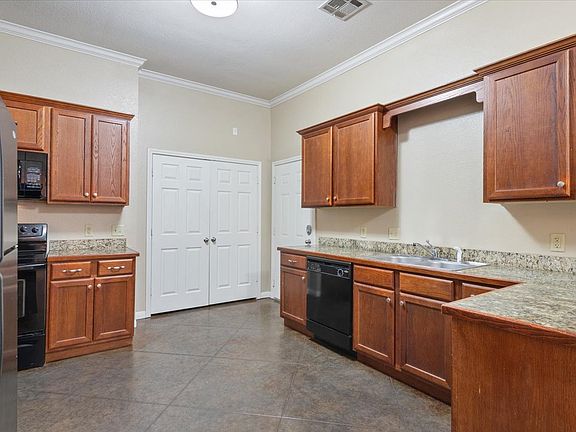 Huge kitchen with a lot of cabinets